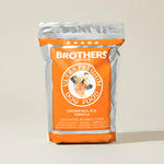 Brothers Complete ultra premium dog food package on a beige background