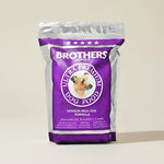 Brothers Ultra Premium Dog Food package on a beige background