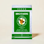 Brothers Ultra Premium Dog Food package on a beige background