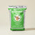 Green bag of Brothers Complete Ultra Premium Dog Food on a beige background