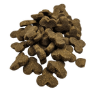 Pile of brown dog treats shaped like bones on a white background